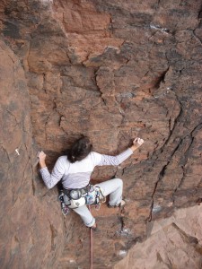 Lola climbing a 6c